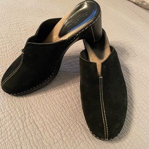 Black suede clogs.